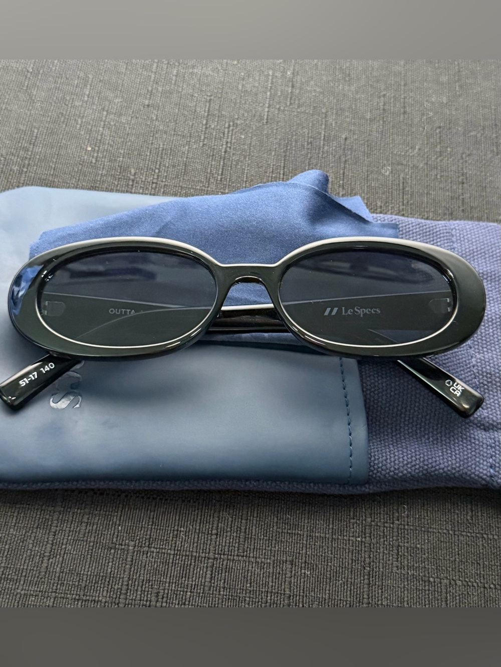 Le Specs Black Oval Sunglasses with Dark Lenses